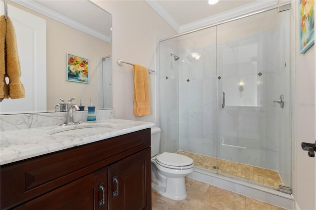 bathroom featuring toilet, vanity, a shower with door, and ornamental molding