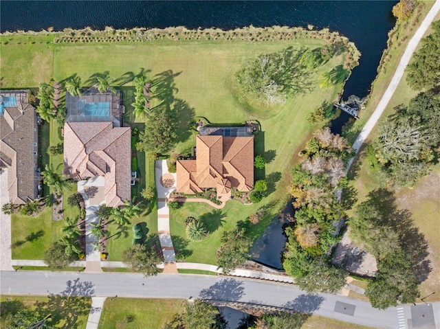 birds eye view of property featuring a water view