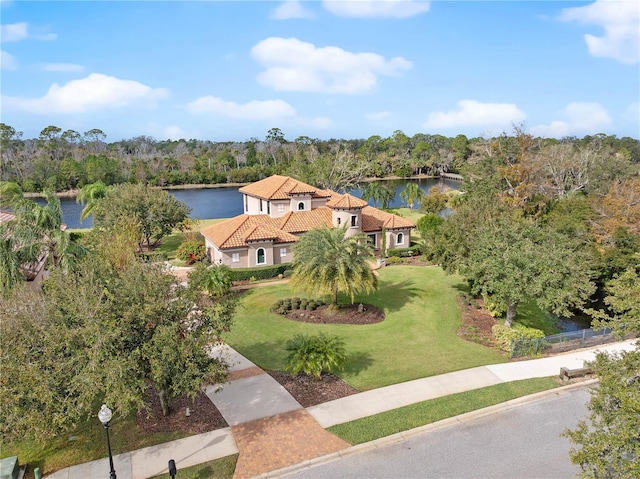 birds eye view of property with a water view