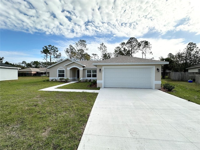 ranch-style house featuring a garage and a front lawn