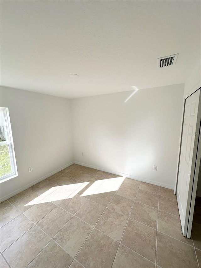 view of tiled empty room