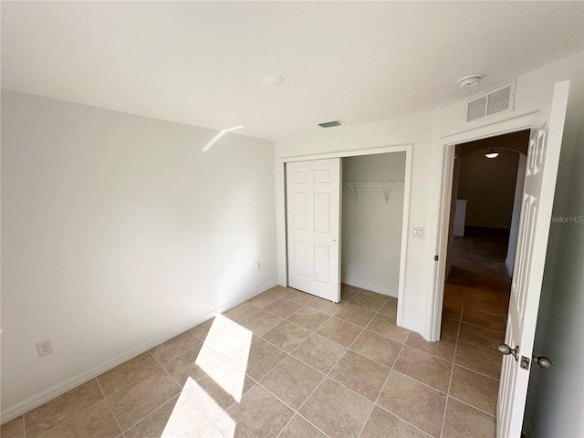 unfurnished bedroom featuring a closet