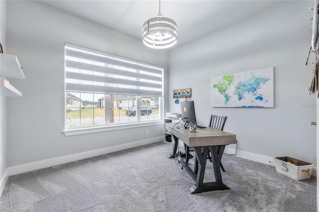 office featuring carpet and a chandelier