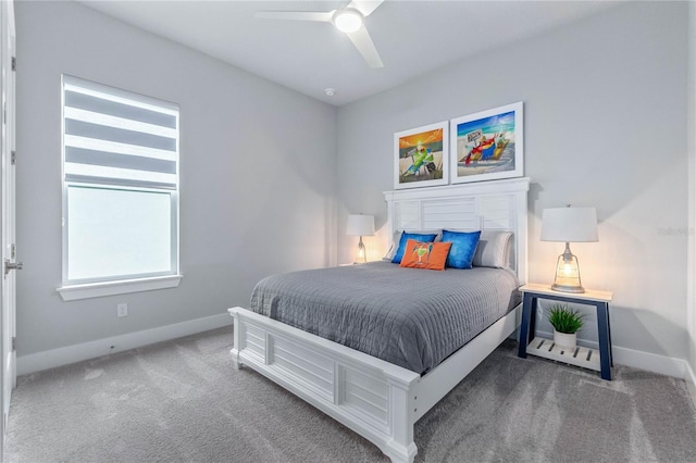 bedroom featuring ceiling fan and dark colored carpet