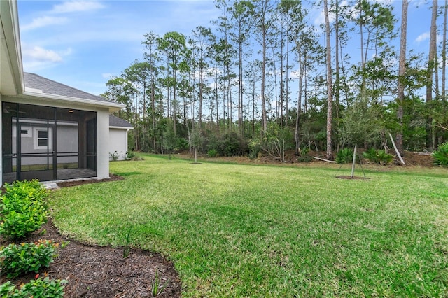 view of yard with a sunroom