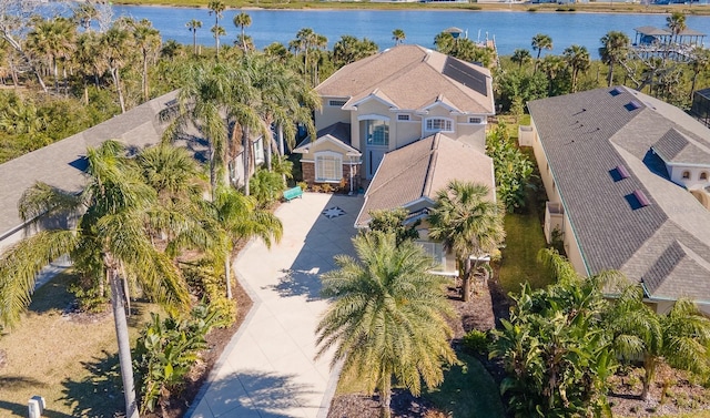 birds eye view of property with a water view