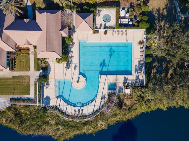 birds eye view of property with a water view