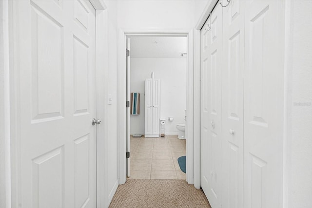 hallway featuring light tile patterned floors