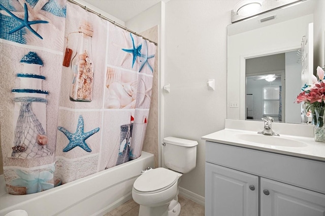 full bathroom with toilet, vanity, tile patterned floors, and shower / bath combo with shower curtain