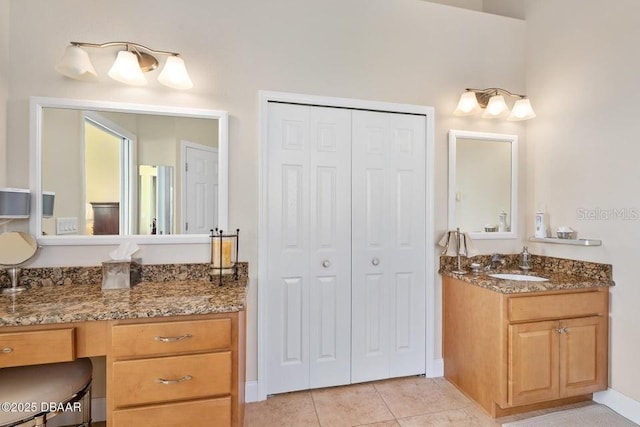 bathroom with tile patterned floors and vanity