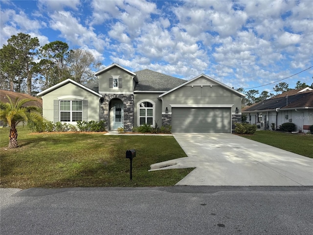 view of front of home featuring a garage and a front lawn