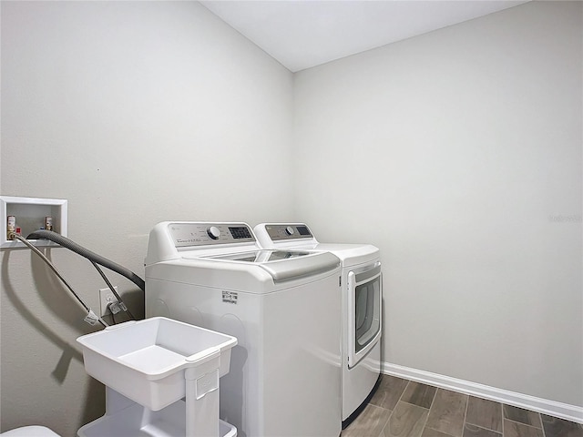 laundry area with separate washer and dryer