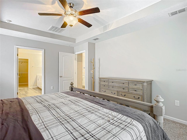 bedroom featuring ceiling fan and connected bathroom