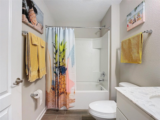 full bathroom featuring a textured ceiling, toilet, vanity, and shower / tub combo