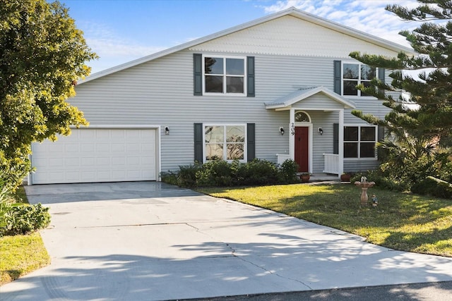 view of front of home with a garage and a front lawn