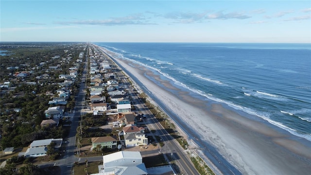 bird's eye view featuring a water view and a view of the beach