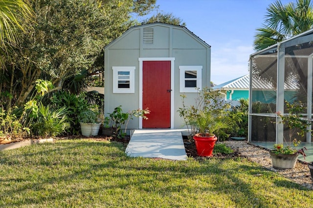 view of outbuilding with a lawn