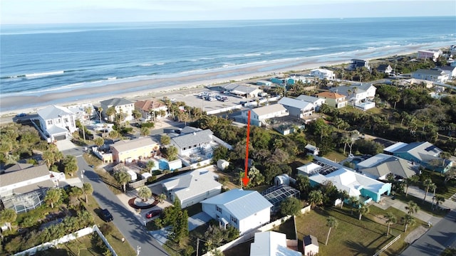 drone / aerial view with a view of the beach and a water view