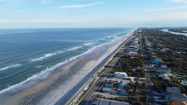 aerial view with a water view and a view of the beach