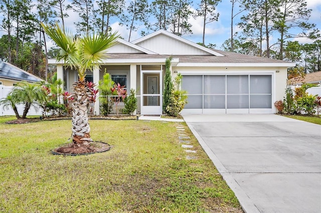 single story home featuring a front yard and a garage