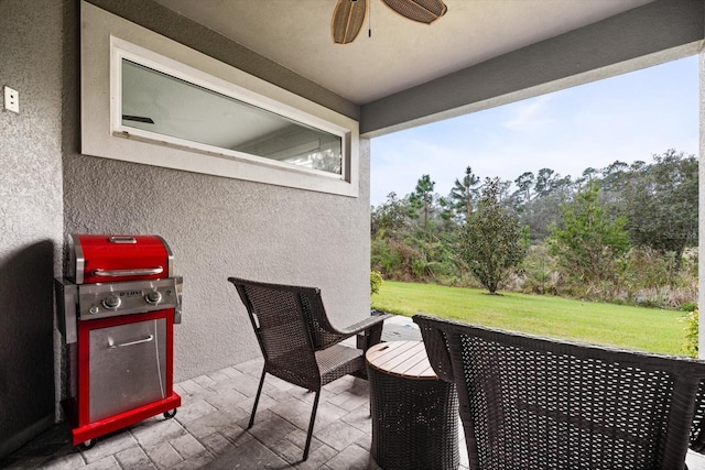 view of patio / terrace featuring ceiling fan