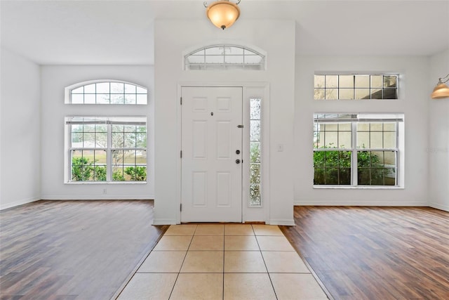 foyer entrance with light wood-type flooring