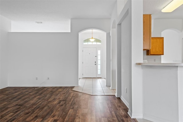 foyer entrance featuring hardwood / wood-style flooring