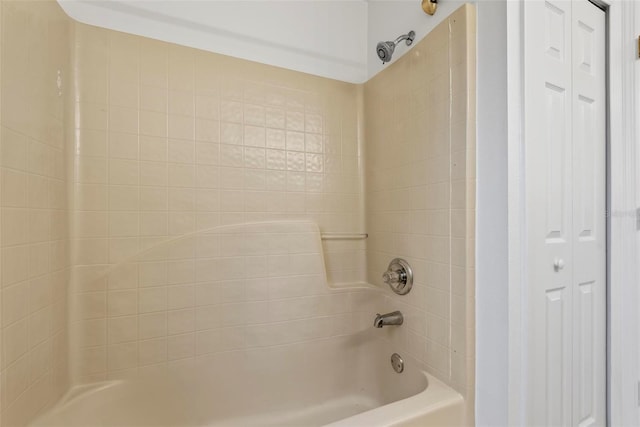 bathroom with bathing tub / shower combination