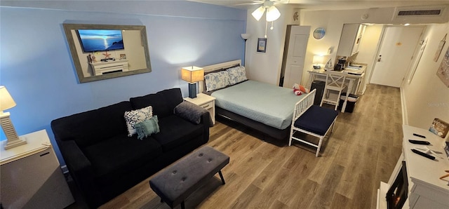 bedroom featuring ceiling fan and light hardwood / wood-style floors