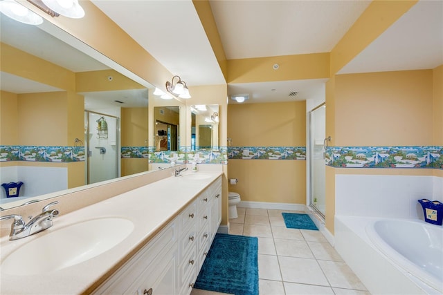 full bathroom featuring toilet, tile patterned flooring, vanity, and independent shower and bath