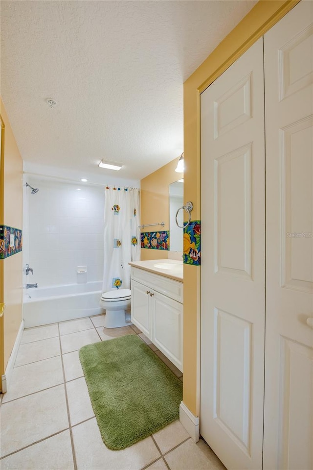 full bathroom with a textured ceiling, shower / tub combo with curtain, tile patterned flooring, toilet, and vanity