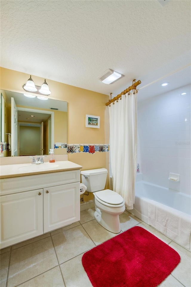 full bathroom with toilet, a textured ceiling, tile patterned flooring, shower / bath combo, and vanity