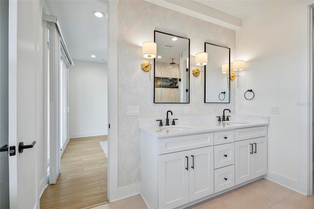 bathroom featuring vanity and hardwood / wood-style flooring