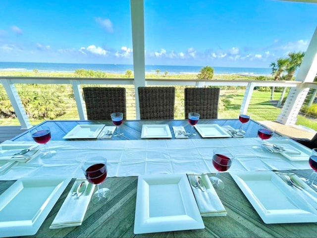 exterior space featuring a water view and a view of the beach