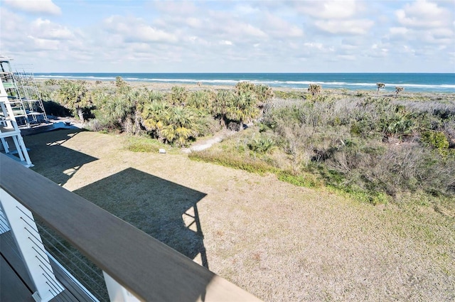 aerial view featuring a view of the beach and a water view