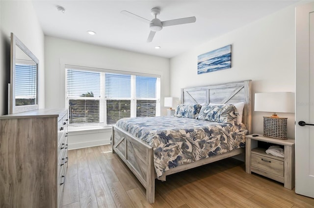 bedroom featuring ceiling fan and light wood-type flooring