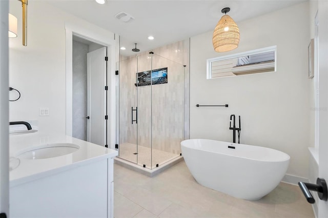 bathroom featuring vanity, tile patterned flooring, and independent shower and bath