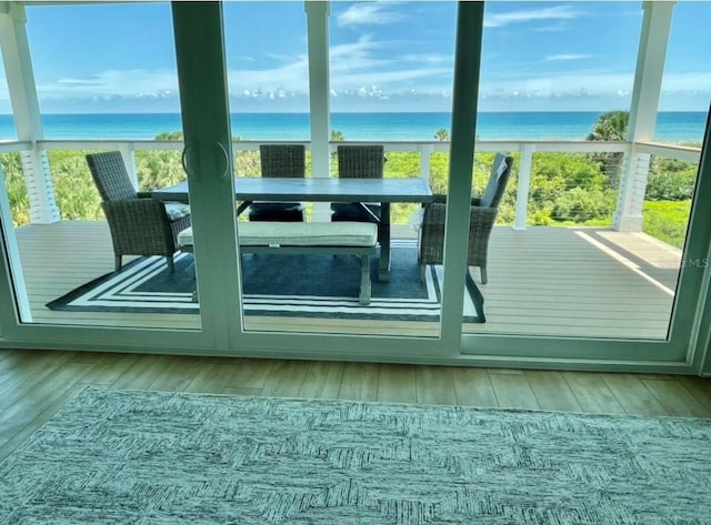 entryway with a water view and hardwood / wood-style floors