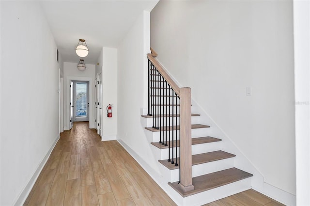 foyer entrance with light hardwood / wood-style flooring