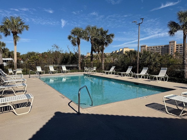 view of swimming pool featuring a patio area