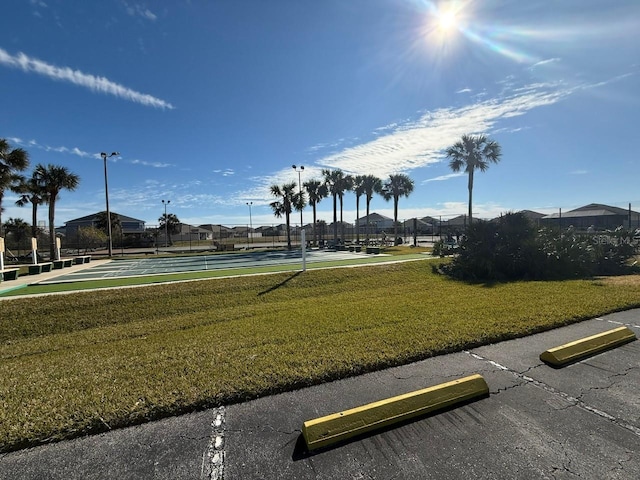 view of property's community featuring a lawn