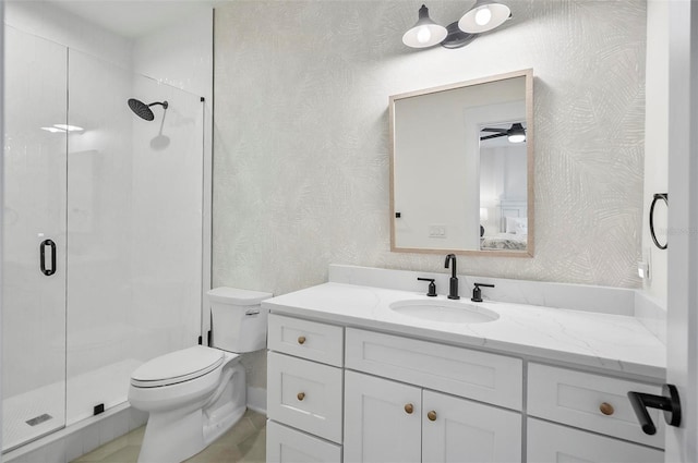 bathroom with walk in shower, tile patterned floors, vanity, and toilet