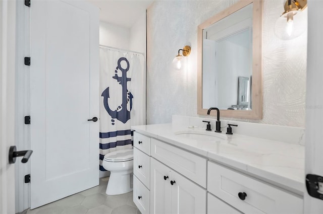 bathroom with tile patterned floors, vanity, and toilet