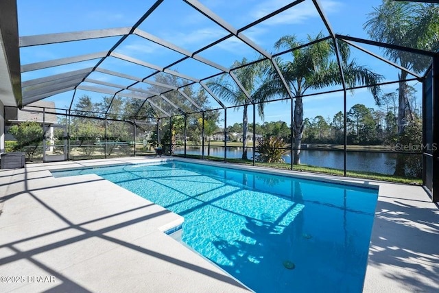 view of pool featuring a patio area, glass enclosure, and a water view