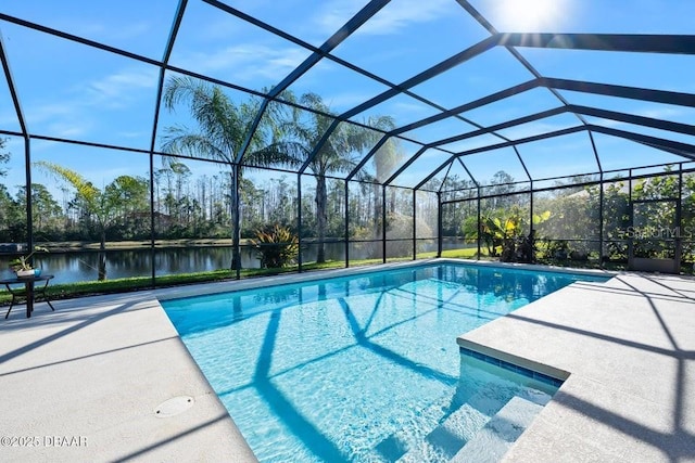 view of swimming pool with a lanai, a patio, and a water view