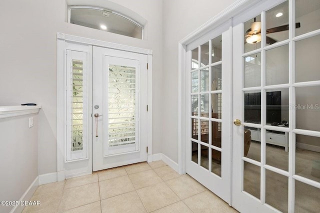 doorway featuring ceiling fan, french doors, light tile patterned floors, and a wealth of natural light