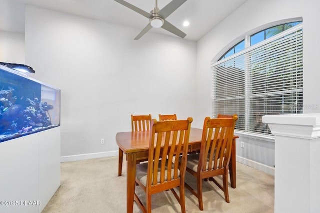 carpeted dining area featuring ceiling fan