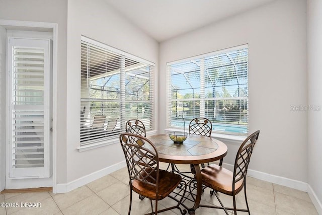 dining space with light tile patterned floors