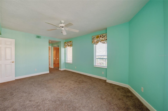 unfurnished bedroom with ceiling fan and carpet flooring