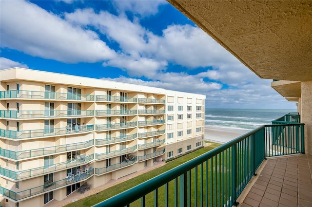 balcony with a beach view and a water view